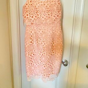 Beautiful melon color dress. Cute and flirty. Size 8